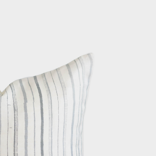 Rectangular linen pillow with gray and white vertical stripes in 18" x 22" dimensions.