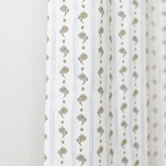 White curtain panel with vertical stripes and gold floral bouquet pattern throughout.