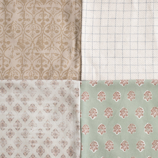 Four fabric swatches with damask and geometric patterns in beige, cream, white, and sage green.
