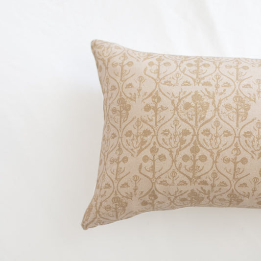 Rectangular pillow with cream and beige damask floral pattern throughout.