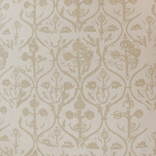 Cream and beige damask patterned fabric with repeating floral and botanical motifs.
