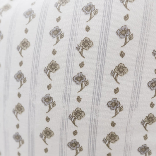 Cream fabric with tan floral motifs and vertical stripe pattern.