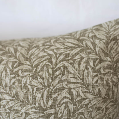 Beige and cream leafy pattern textile with woven texture detail.