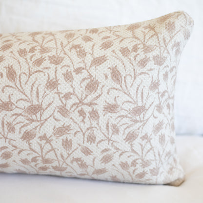 Beige and cream rectangular pillow with floral leaf pattern in thick woven fabric.