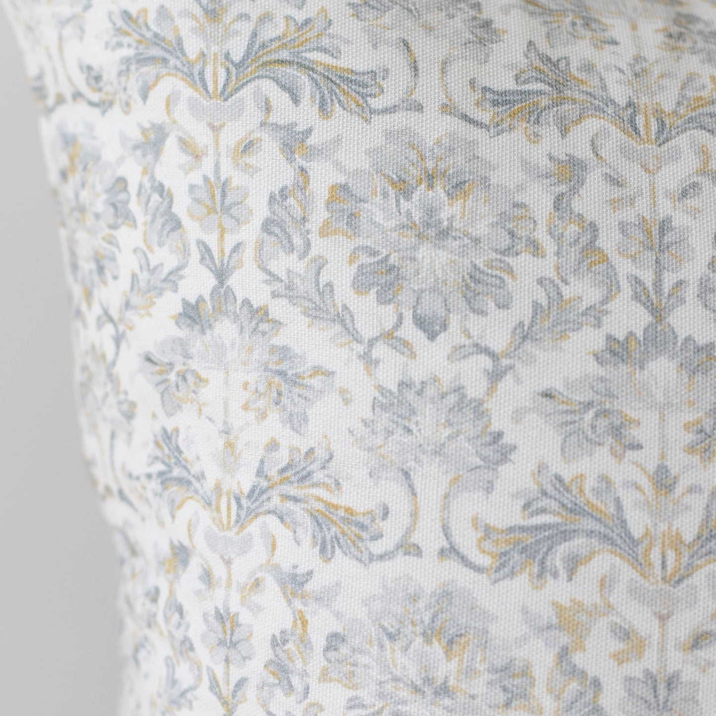 Cream linen fabric with blue and gold floral damask pattern.