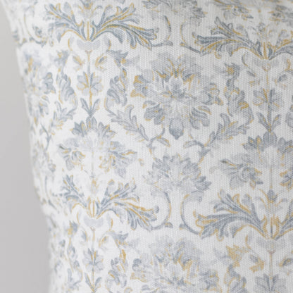 Cream linen fabric with blue and gold floral damask pattern.