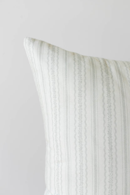 Cream and beige striped pillow cover with vertical woven texture pattern.