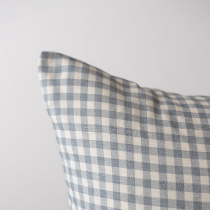 Dusty blue and cream gingham plaid pillow cover with woven texture.