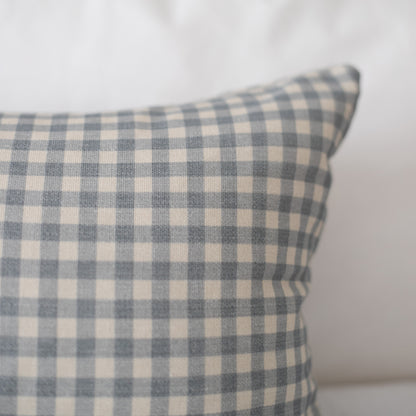 Dusty blue and cream gingham checkered pillow cover with woven texture.