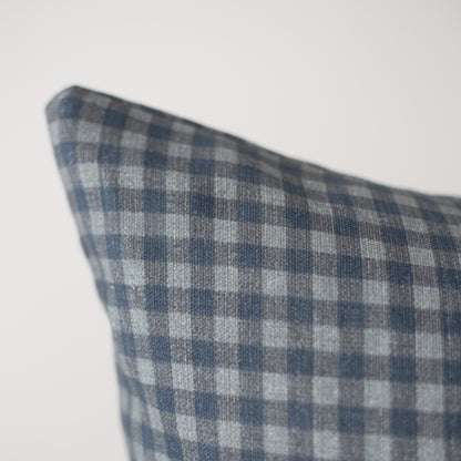 Navy and white gingham patterned pillow cover with checkered weave texture.