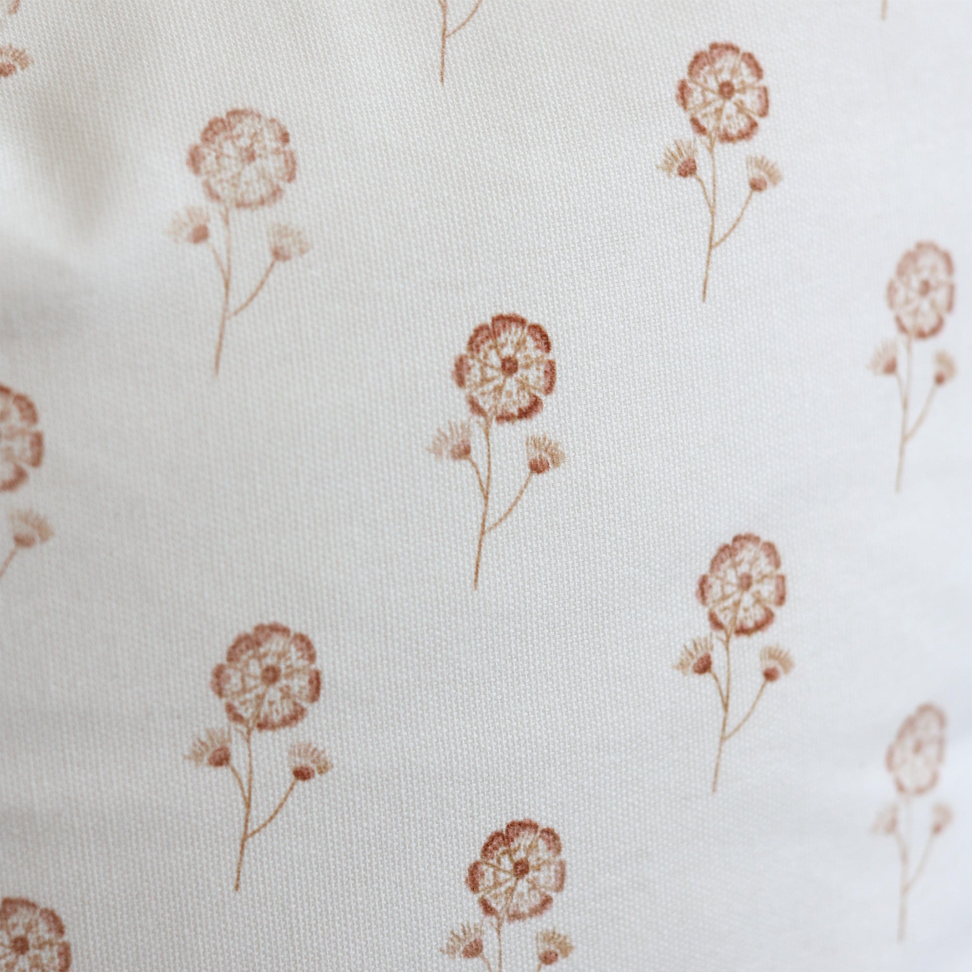 Cream fabric with scattered rust-colored dandelion flower pattern.