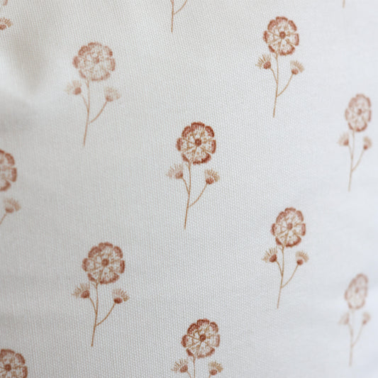 Cream fabric with scattered rust-colored dandelion flower pattern.
