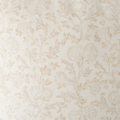 Cream and beige damask pattern on textured fabric surface.