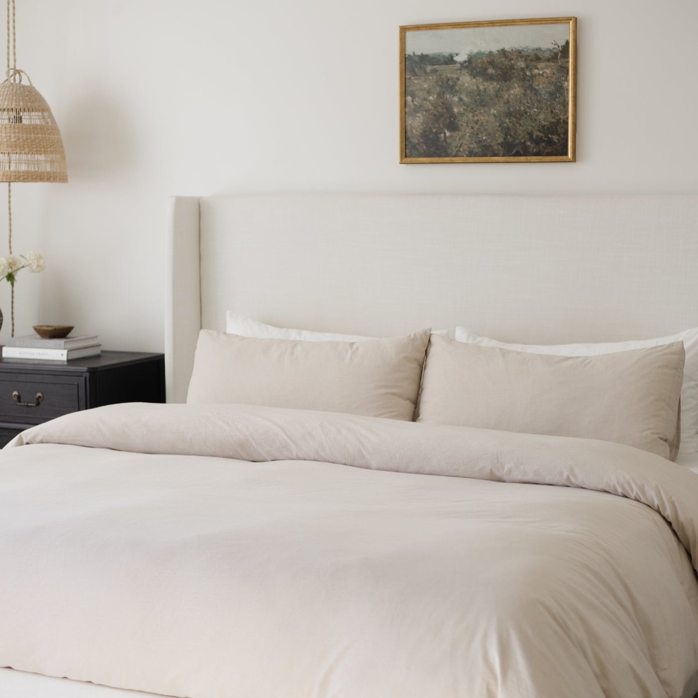 Beige duvet cover set on king bed with matching pillowcases and neutral bedding styling.