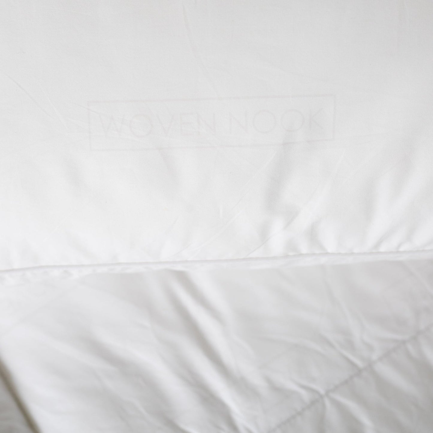 White king duvet insert with stitched seams and quilted texture detail.