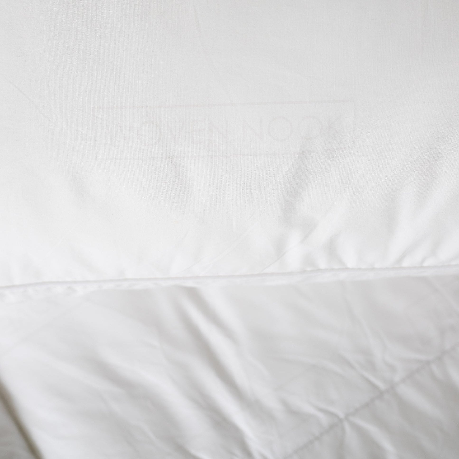 White king duvet insert with stitched seams and quilted texture detail.
