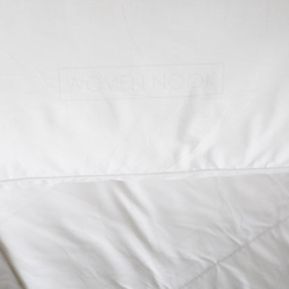 White king duvet insert with stitched seams and quilted texture detail.