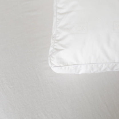 White faux down insert pillow sham with stitched edge detail.