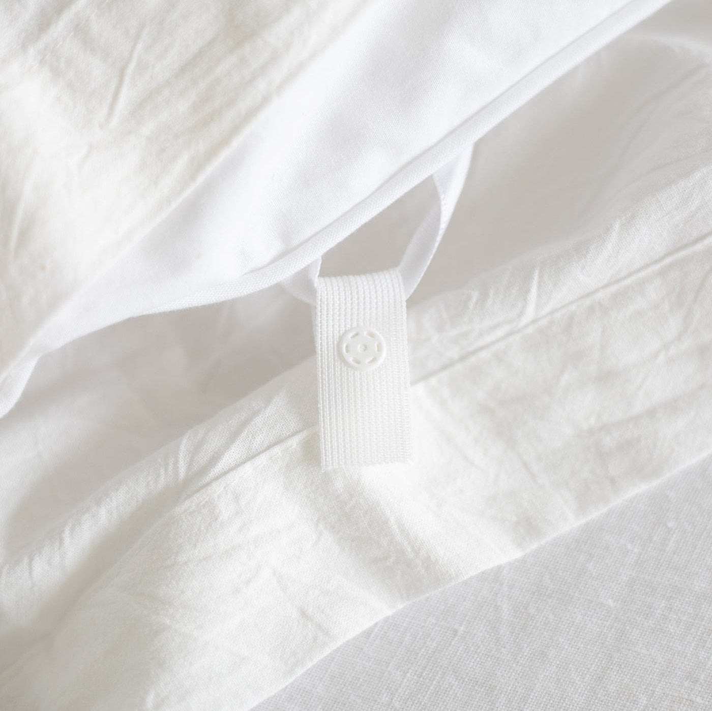 White king duvet insert with quilted texture and corner tie closure detail.