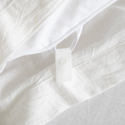 White king duvet insert with quilted texture and corner tie closure detail.