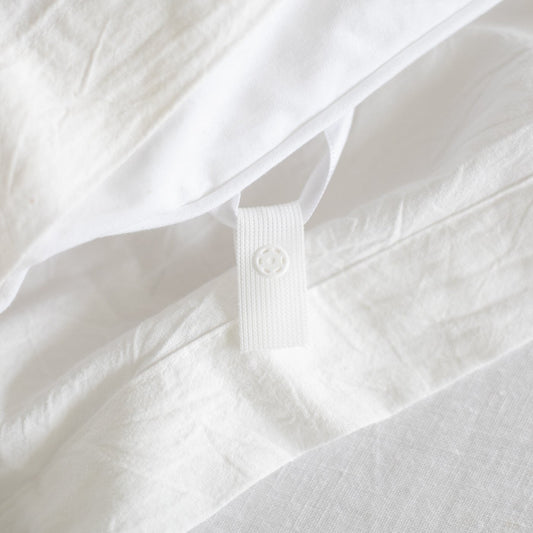 White king duvet insert with quilted texture and corner tie closure detail.