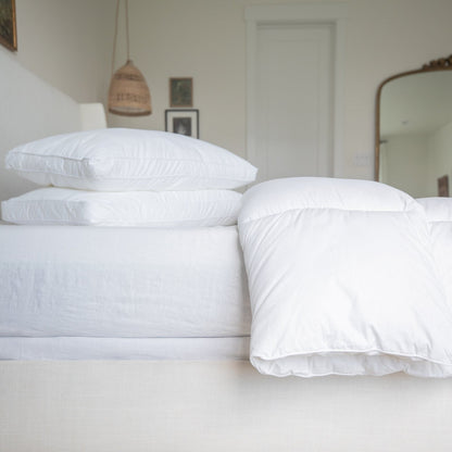White king duvet insert displayed on bed with pillows in a bedroom setting.