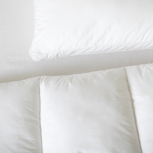 White king duvet insert with gathered corners displayed flat with matching pillowcase.