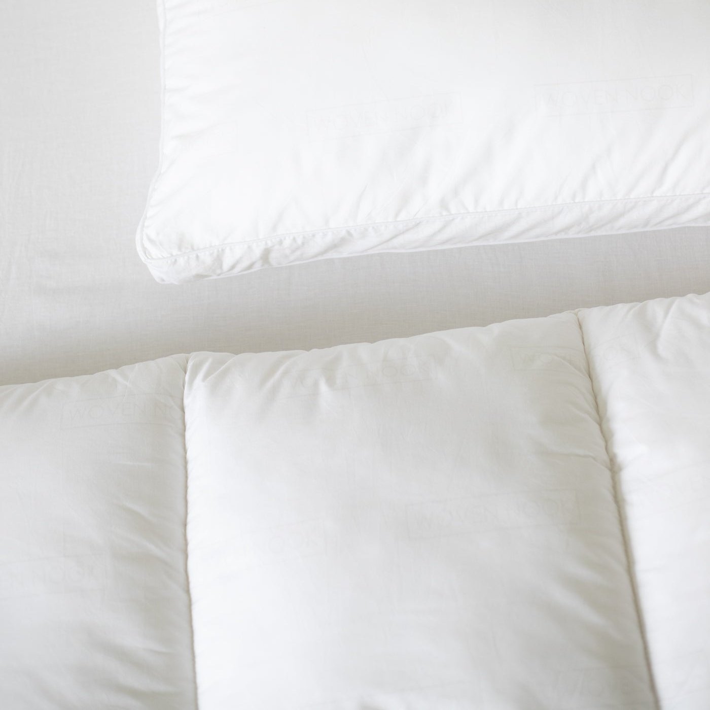 White duvet insert and cream pillowcase displayed flat on neutral background.