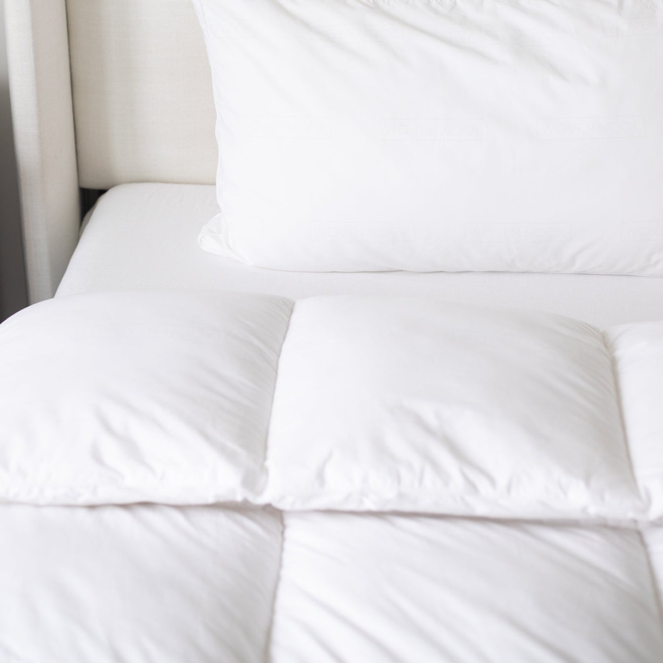 White king duvet insert with quilted sections displayed on a bed with matching pillows.