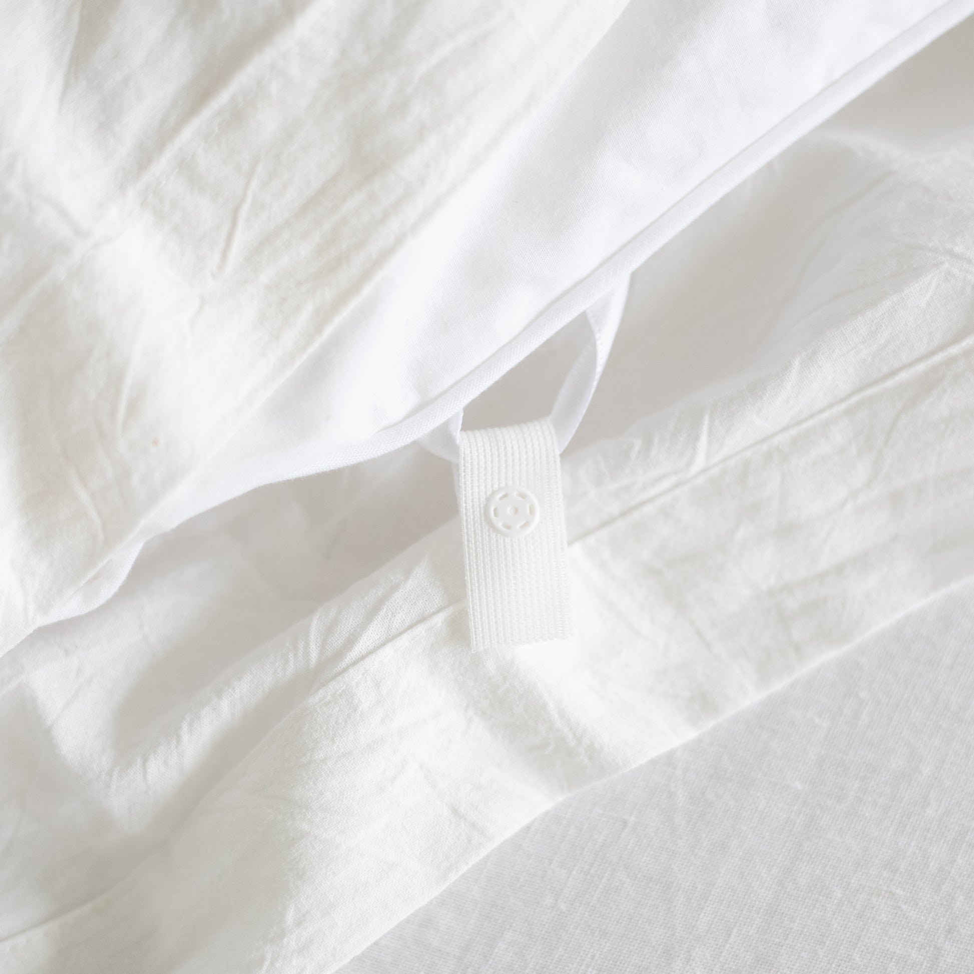 White duvet insert with corner ties and quilted texture detail.