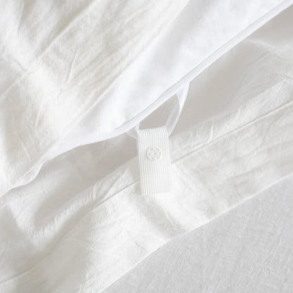White duvet insert with corner ties and quilted texture detail.