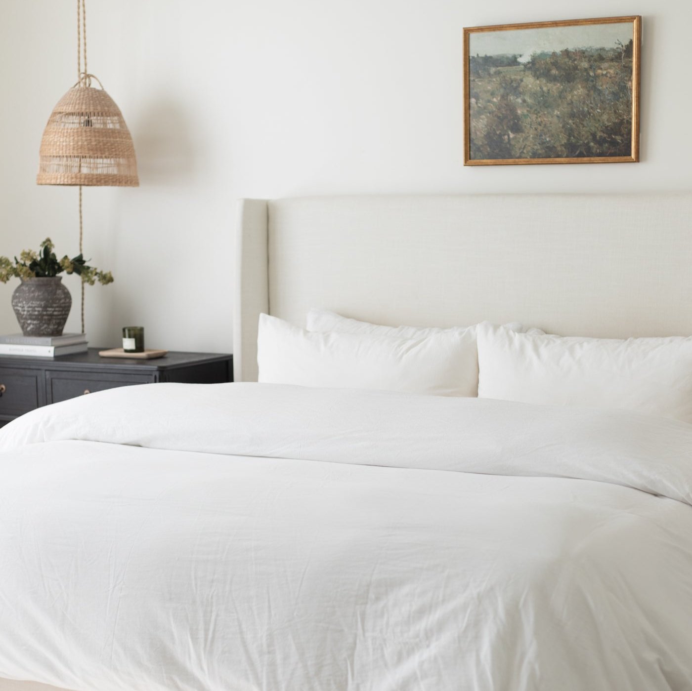 White king duvet cover set on bed with matching pillowcases in bedroom setting.