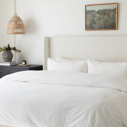 White king duvet cover set on bed with matching pillowcases in bedroom setting.