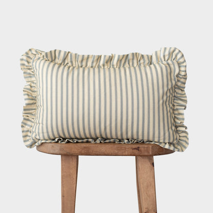 Rectangular pillow with blue and cream vertical stripes and ruffled edges on all sides, displayed on wooden legs.