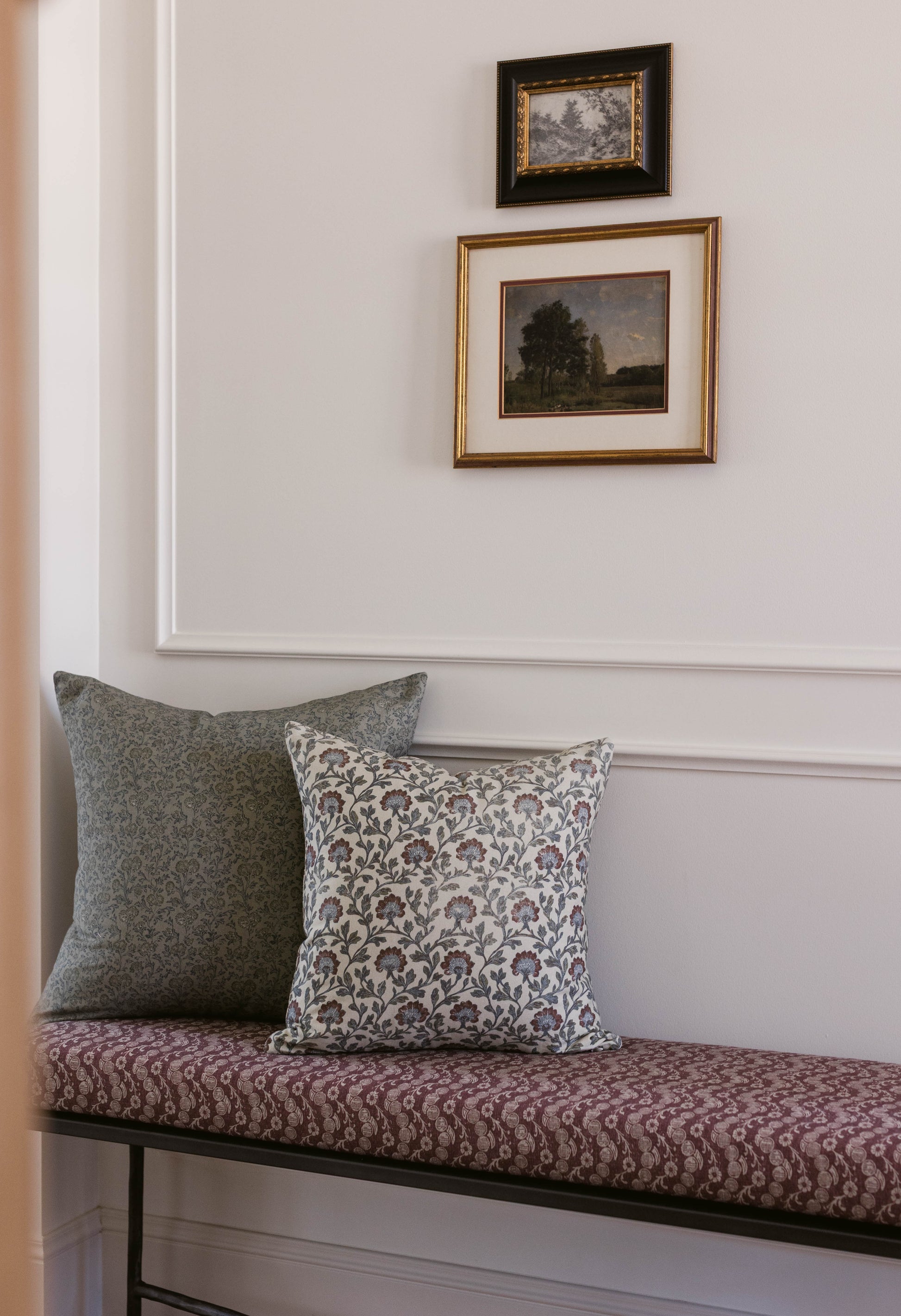 Rectangular throw pillow with multicolor floral and geometric pattern in cream, gray, and burgundy tones.