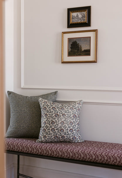 Rectangular throw pillow with multicolor floral and geometric pattern in cream, gray, and burgundy tones.