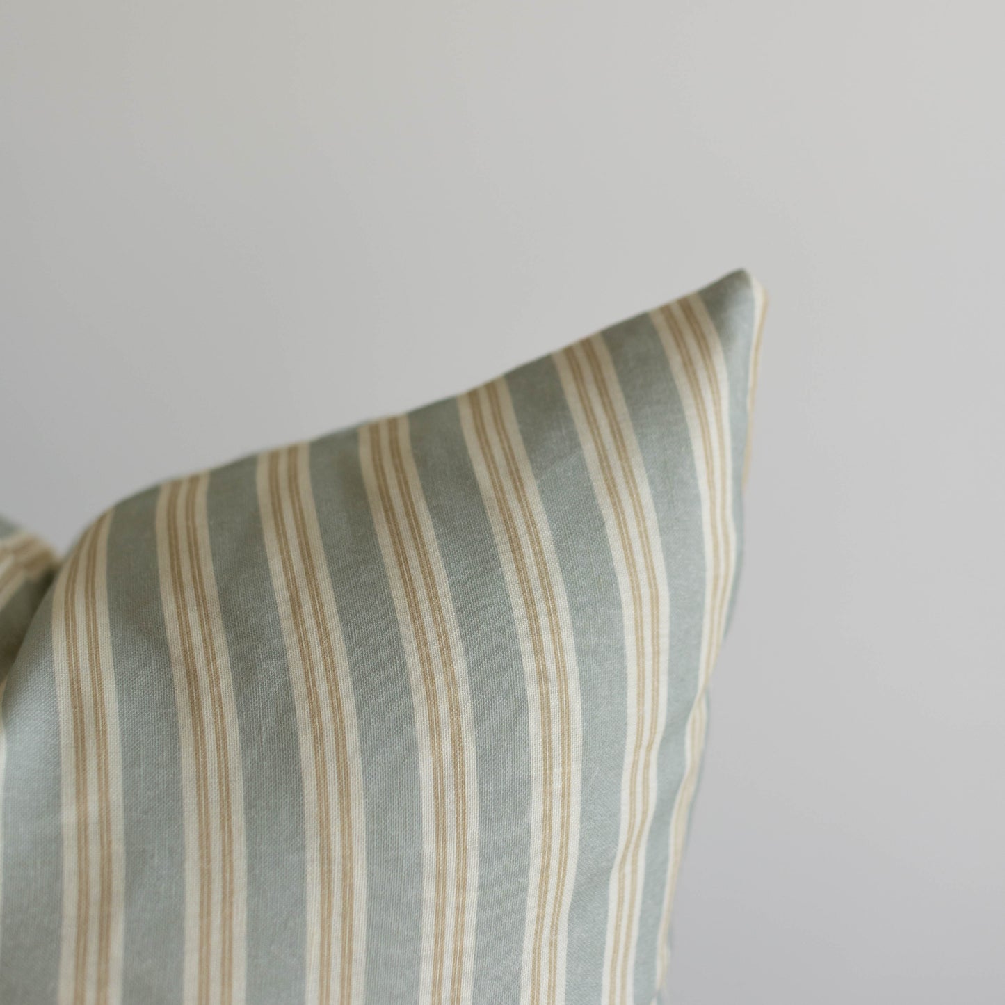 Crosby pillow with vertical sage green and cream stripes in multiple sizes.