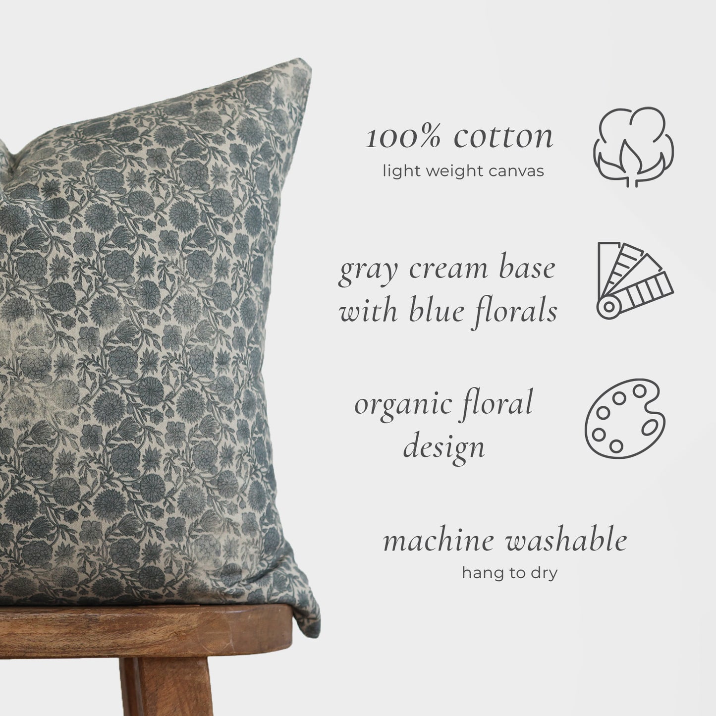 Blue and gray floral patterned pillow cover in 100% cotton canvas on wooden chair.