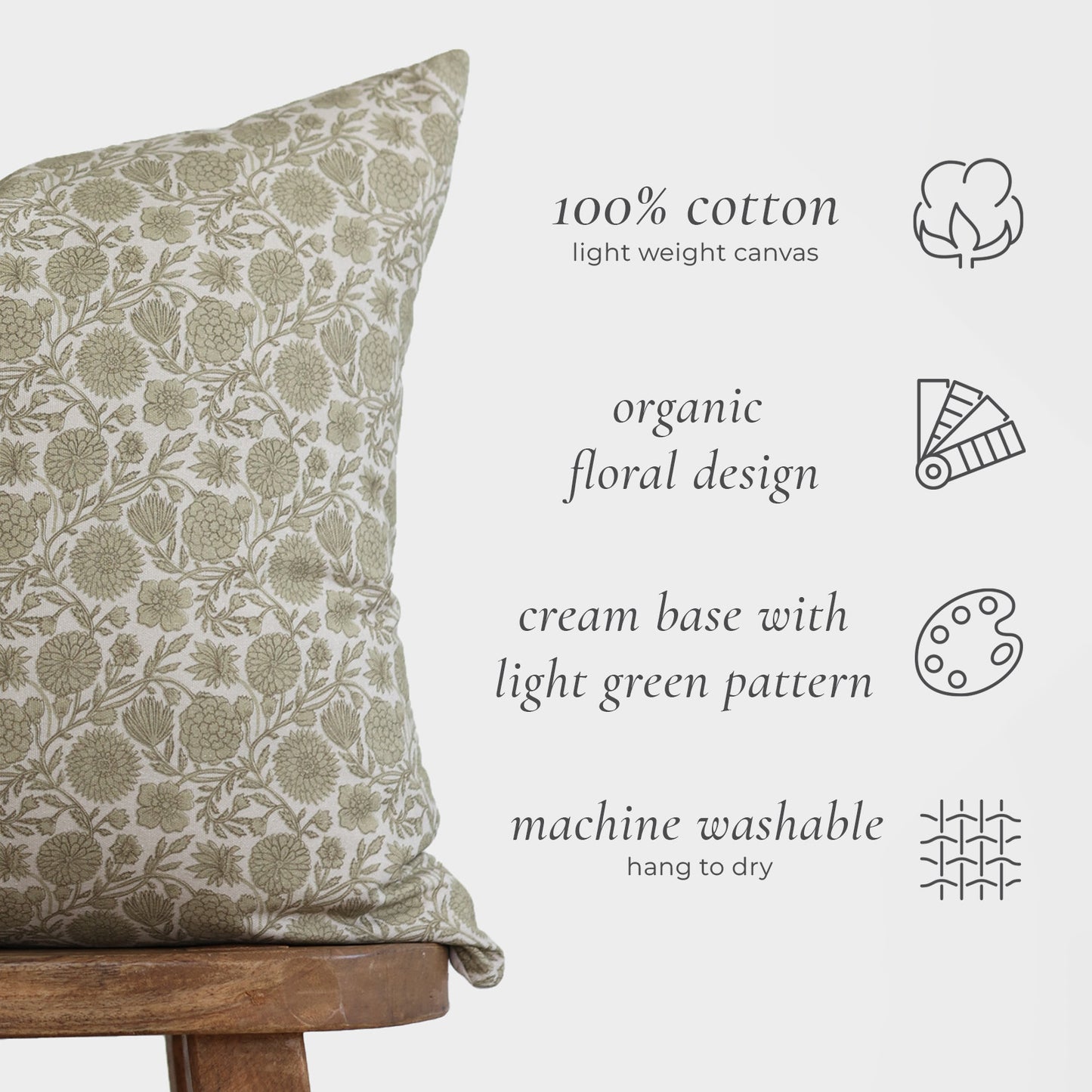 Lumbar pillow with cream background and light green floral pattern on 100% cotton canvas.