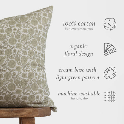 Lumbar pillow with cream background and light green floral pattern on 100% cotton canvas.