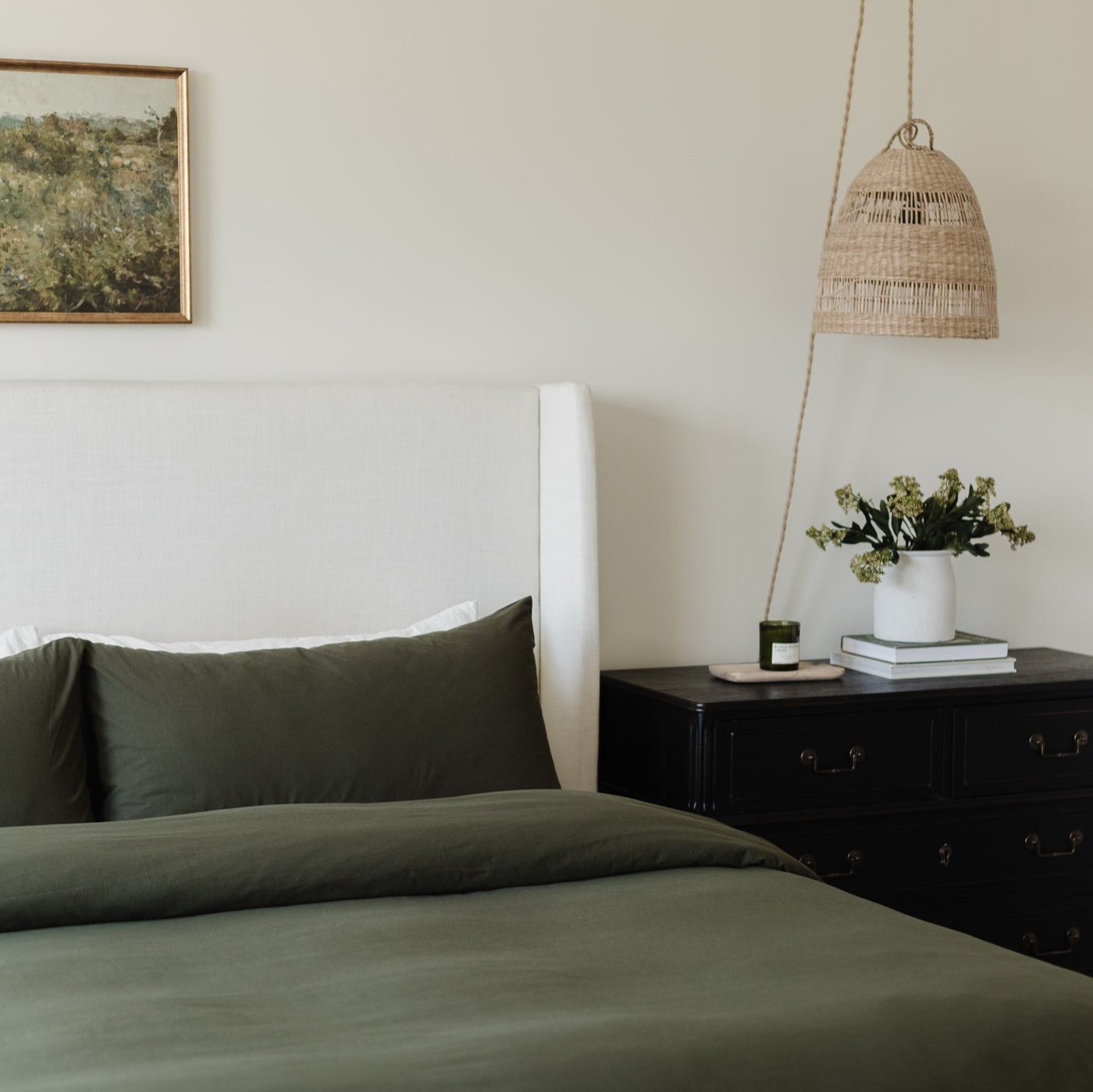 King duvet cover set in olive green on bed with matching pillowcase.
