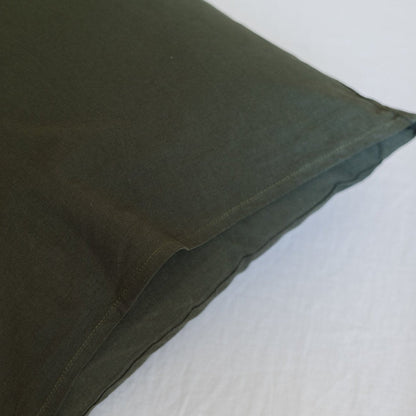 Olive-green duvet cover with visible seam detail and soft fabric texture.
