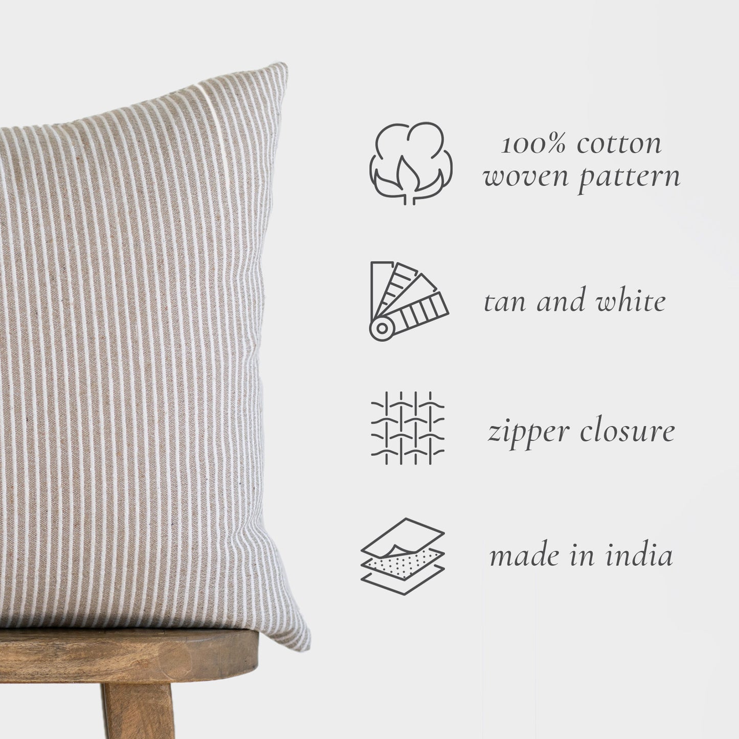 Tan and white striped cotton pillow cover with vertical ribbed texture and zipper closure.