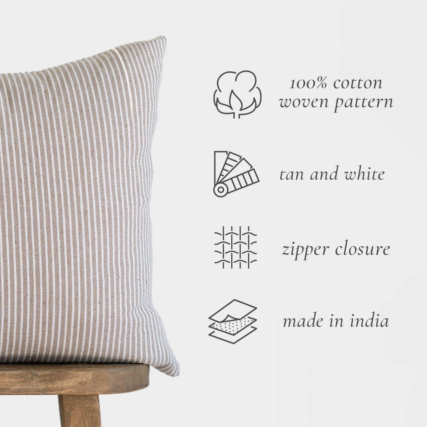 Tan and white striped cotton pillow cover with vertical ribbed texture and zipper closure.