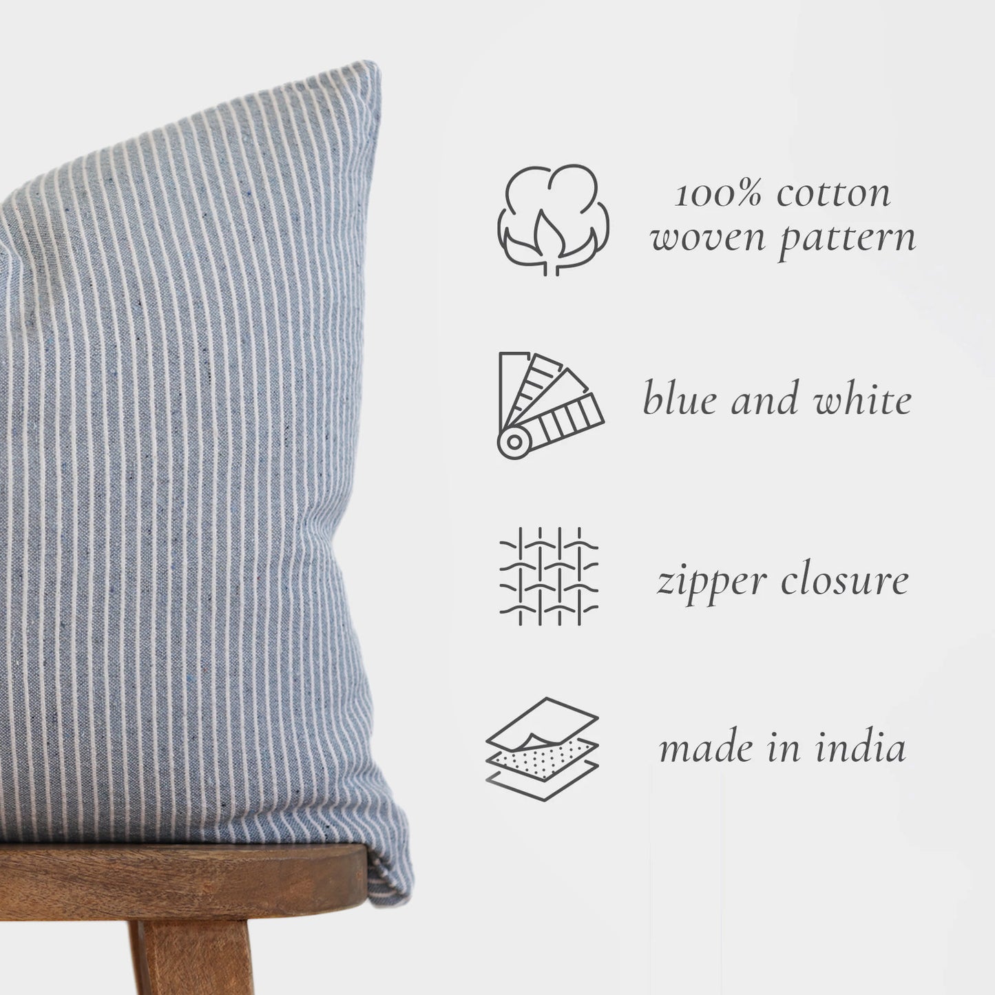 Blue and white striped cotton pillow with vertical ribbed texture and zipper closure.