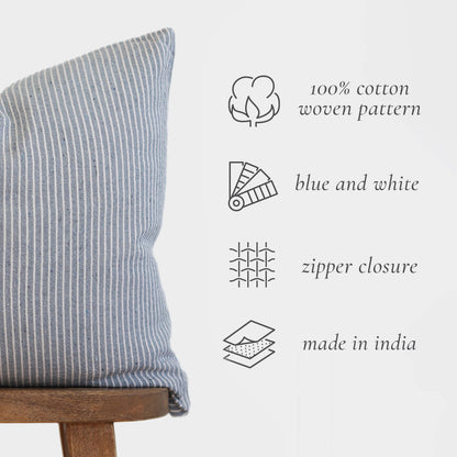 Blue and white striped cotton pillow with vertical ribbed texture and zipper closure.