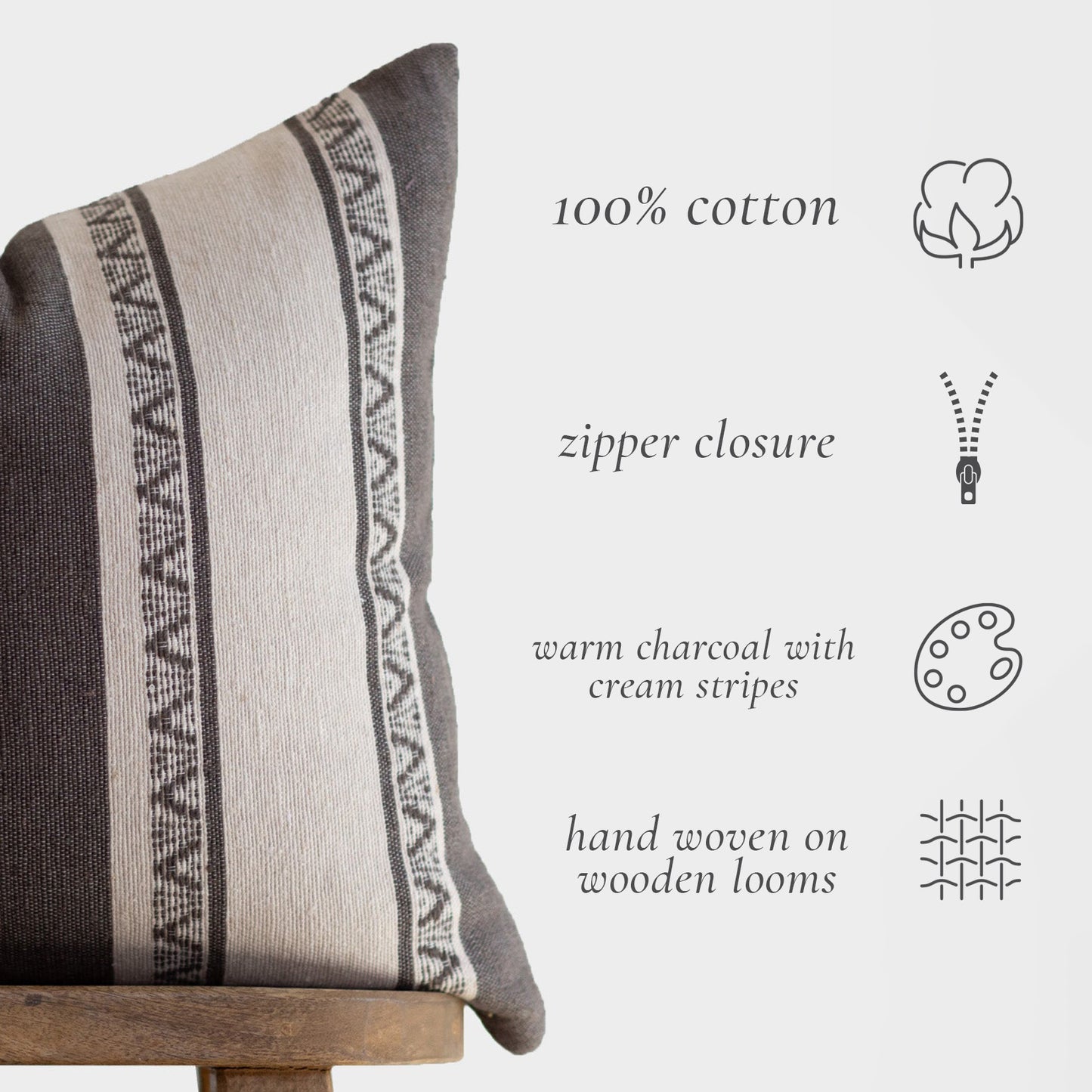 Charcoal and cream striped cotton pillow with geometric woven pattern and zipper closure.