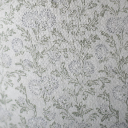 Cream linen fabric with scattered sage green leaf pattern throughout.