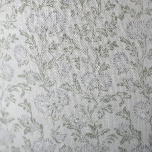 Cream linen fabric with scattered sage green leaf pattern throughout.