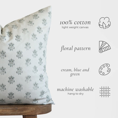 Cream pillow with blue-green floral pattern, 100% cotton canvas, shown in multiple sizes.